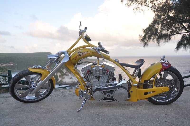 Yellow chopper motorcycle by the sea