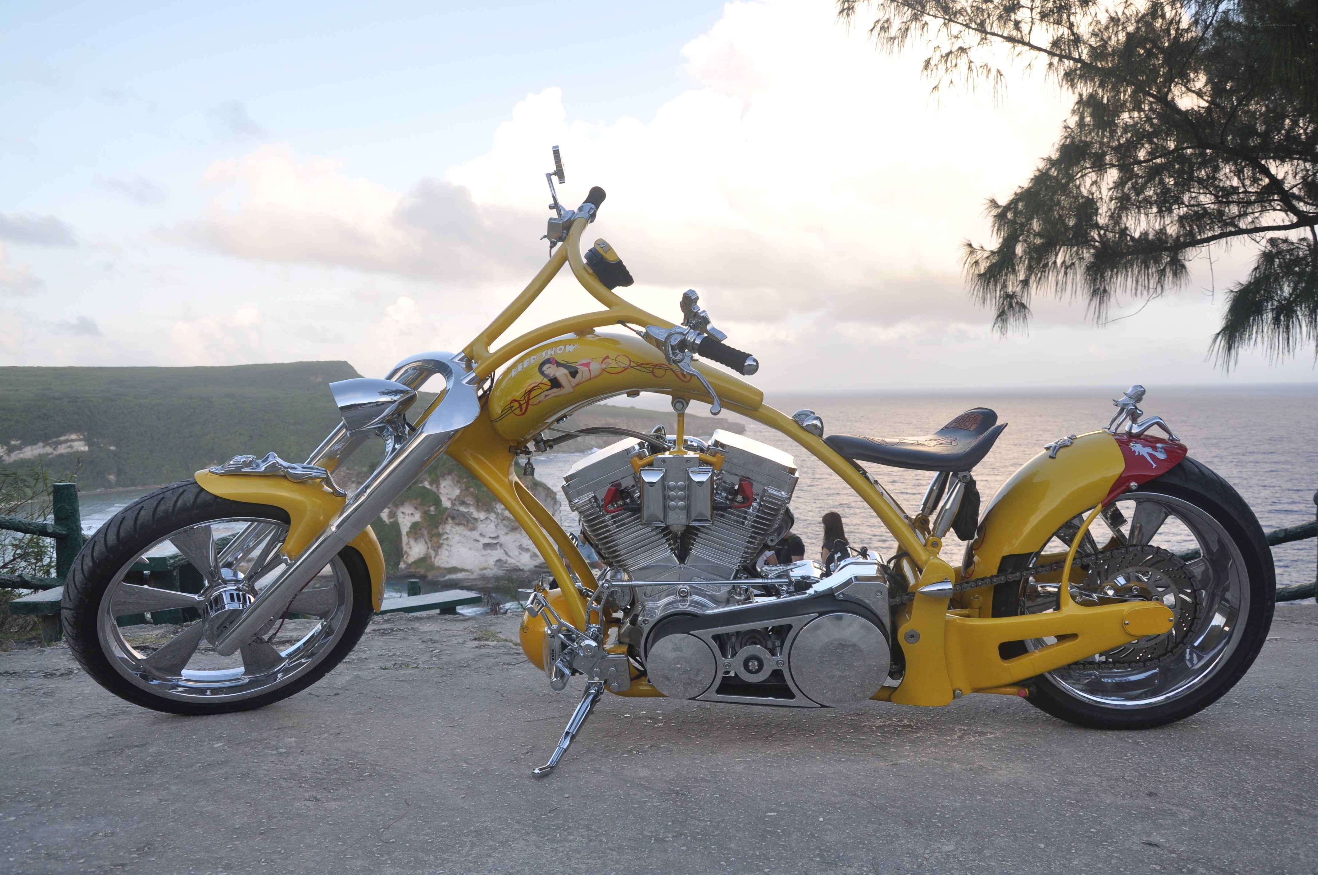 Yellow chopper motorcycle by the sea