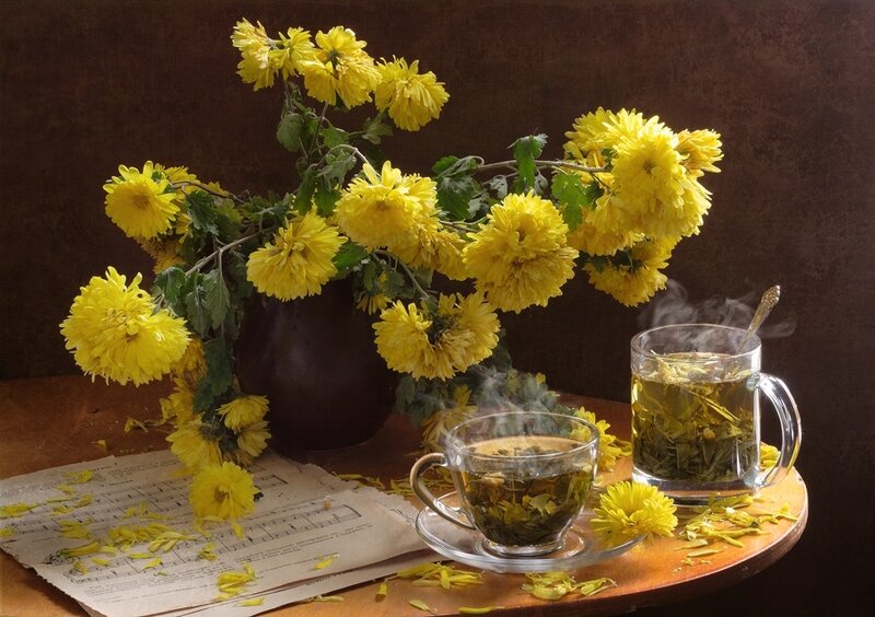 Yellow chrysanthemums and tea