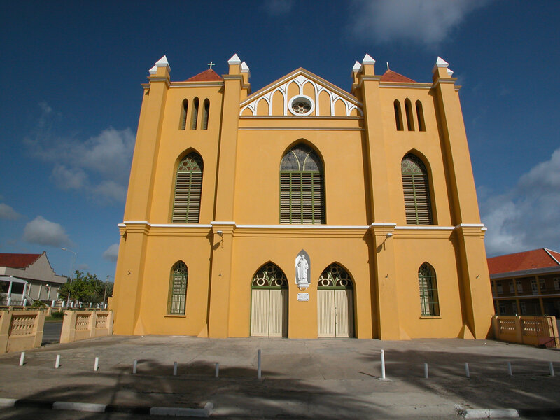 yellow church with arched windows