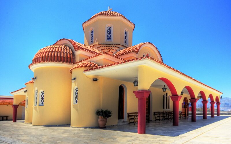 yellow church with red roof