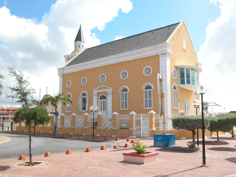 yellow church with steeple