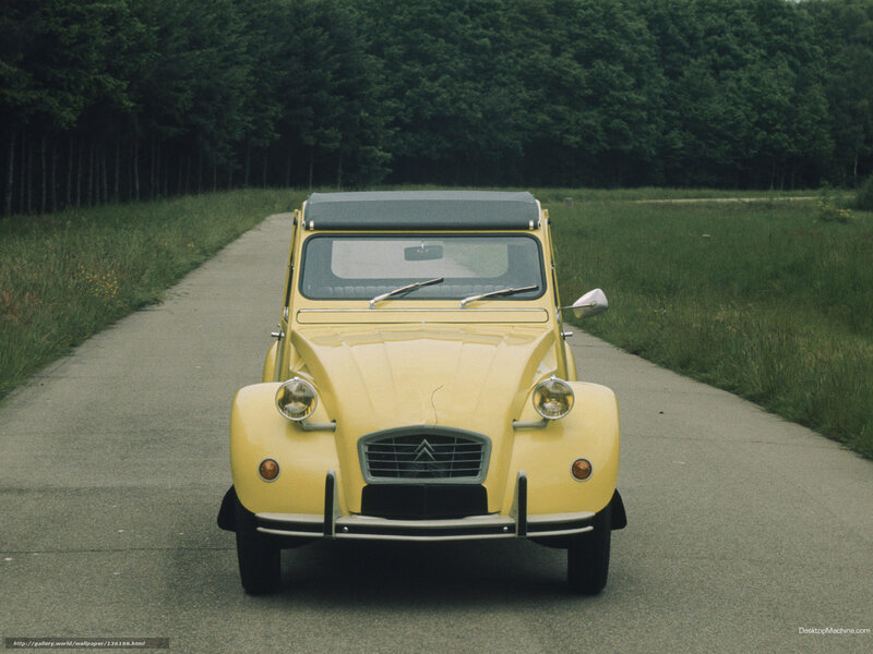 Yellow Citroen 2CV on a country road