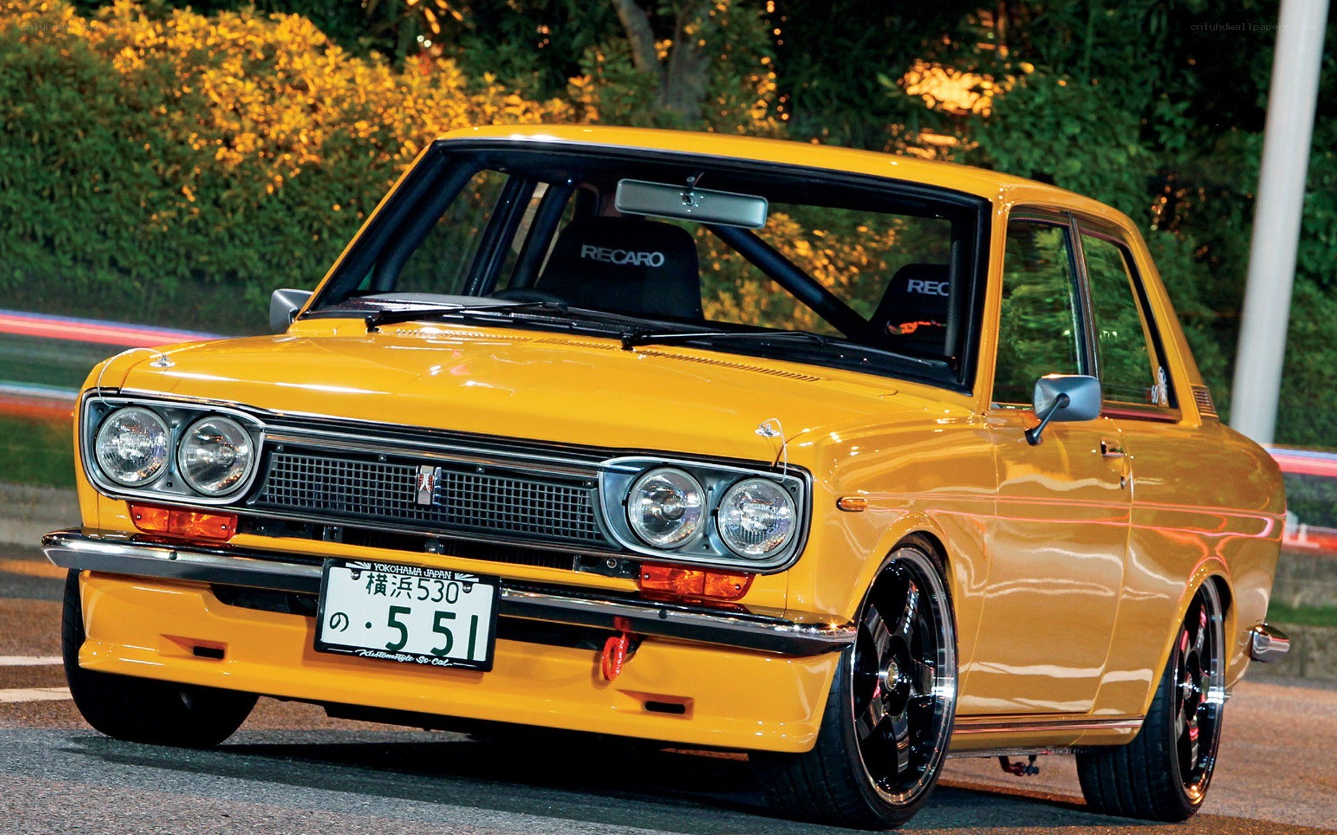 Yellow classic car at night
