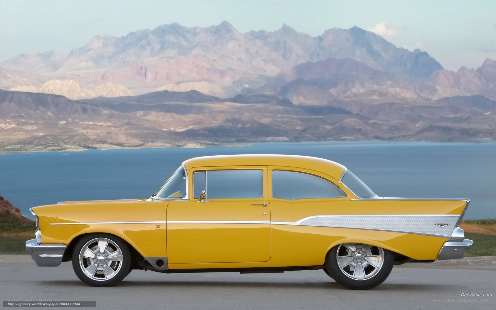 Yellow classic car by lake