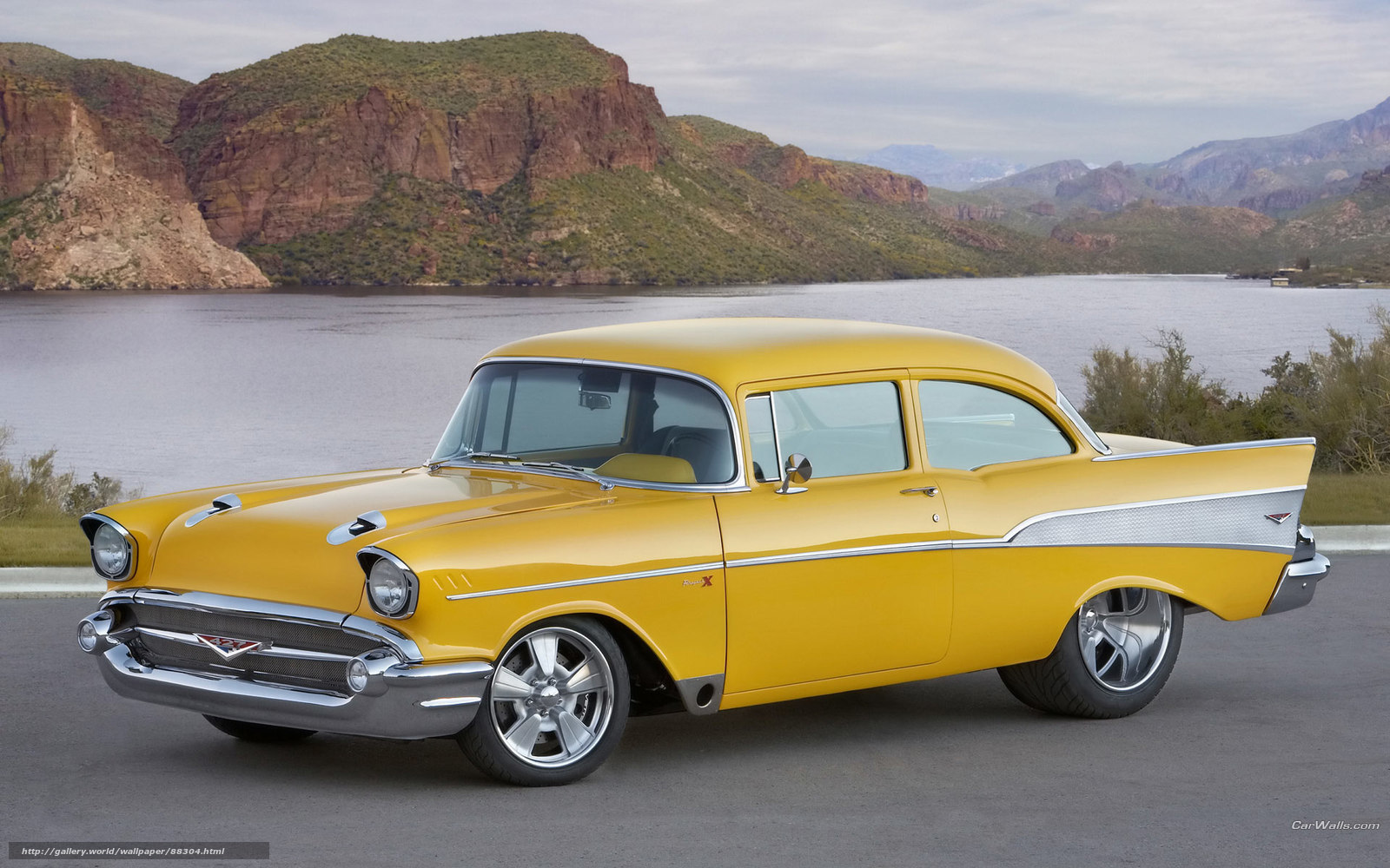 Yellow classic car by lake