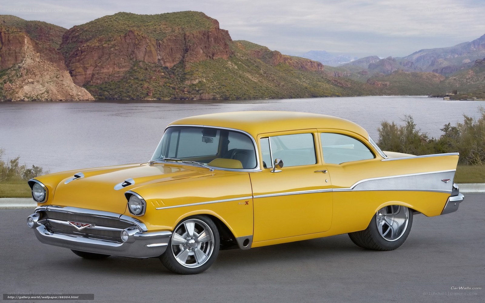Yellow classic car by lake