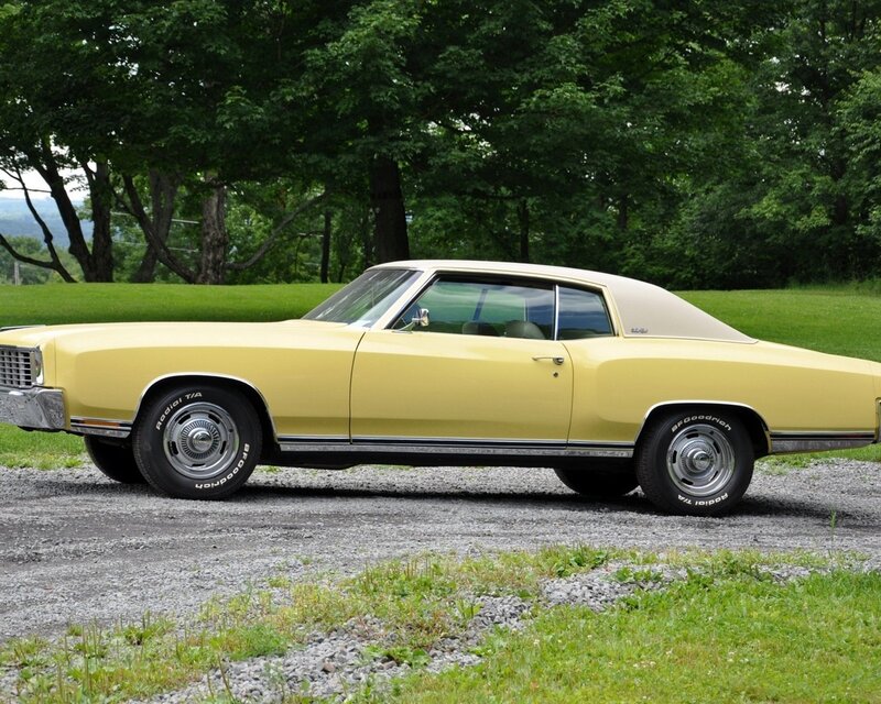 yellow classic car in field