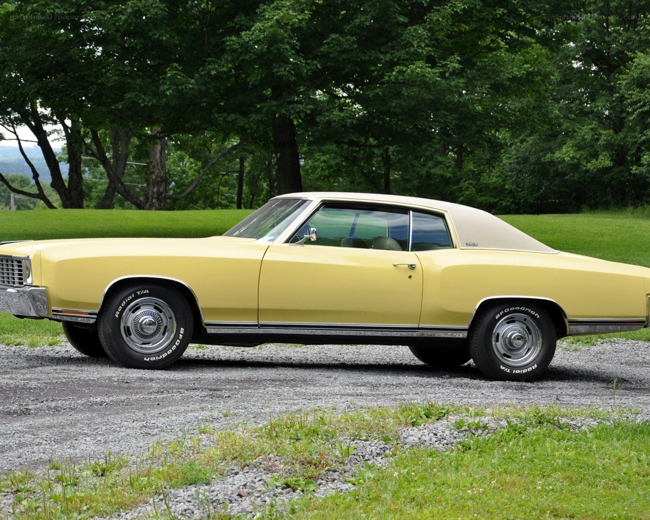 yellow classic car in field