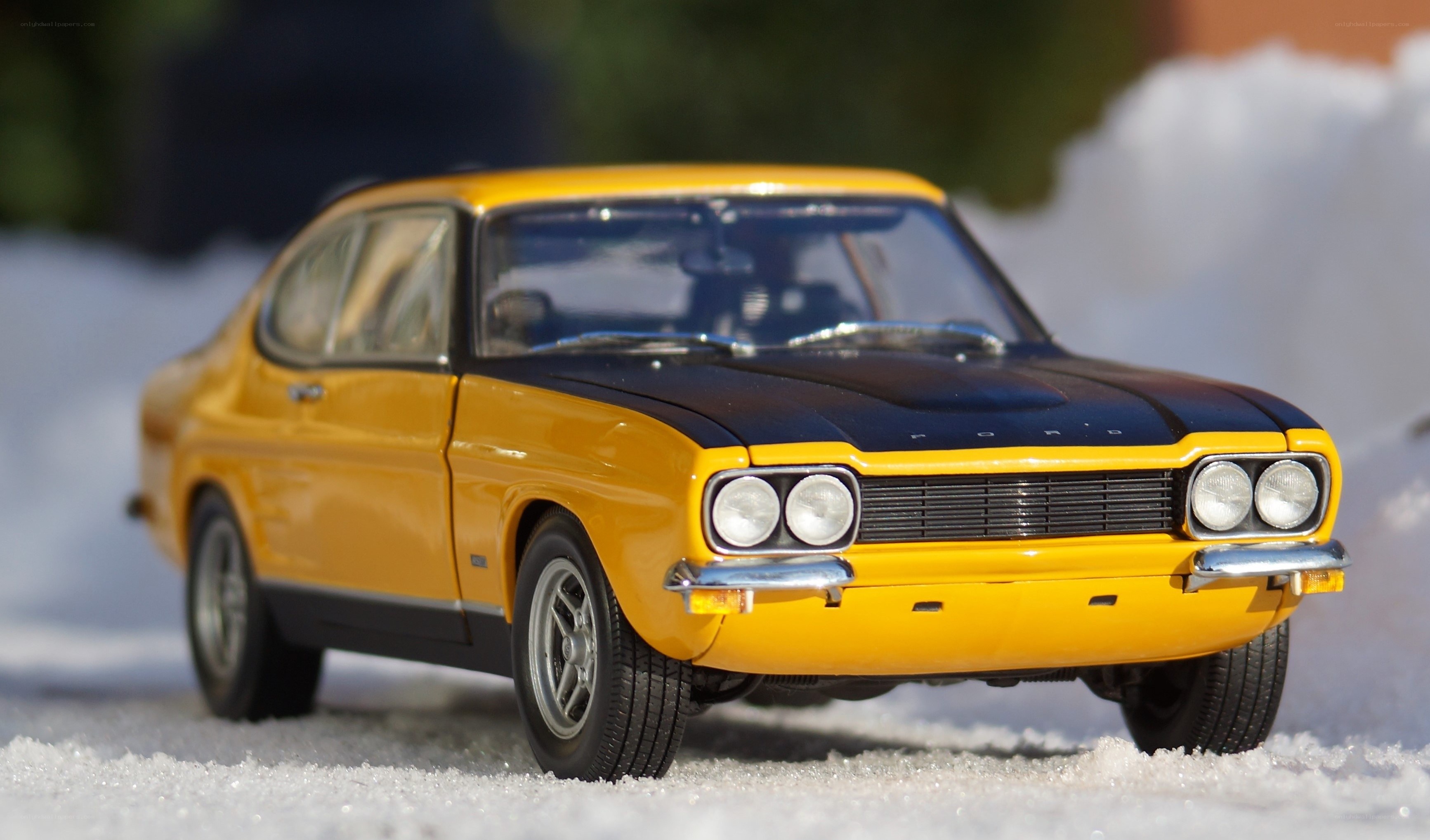Yellow classic car in snow