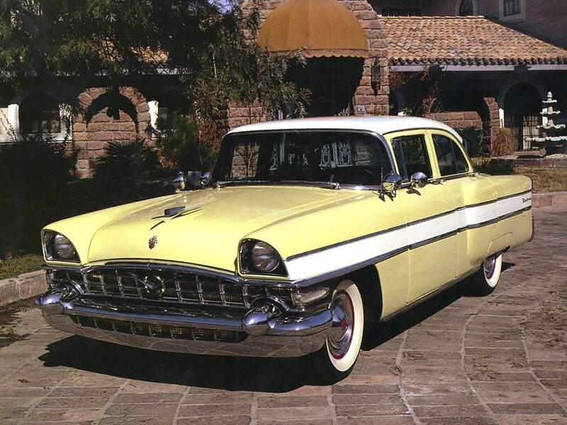 Yellow classic car on cobblestone