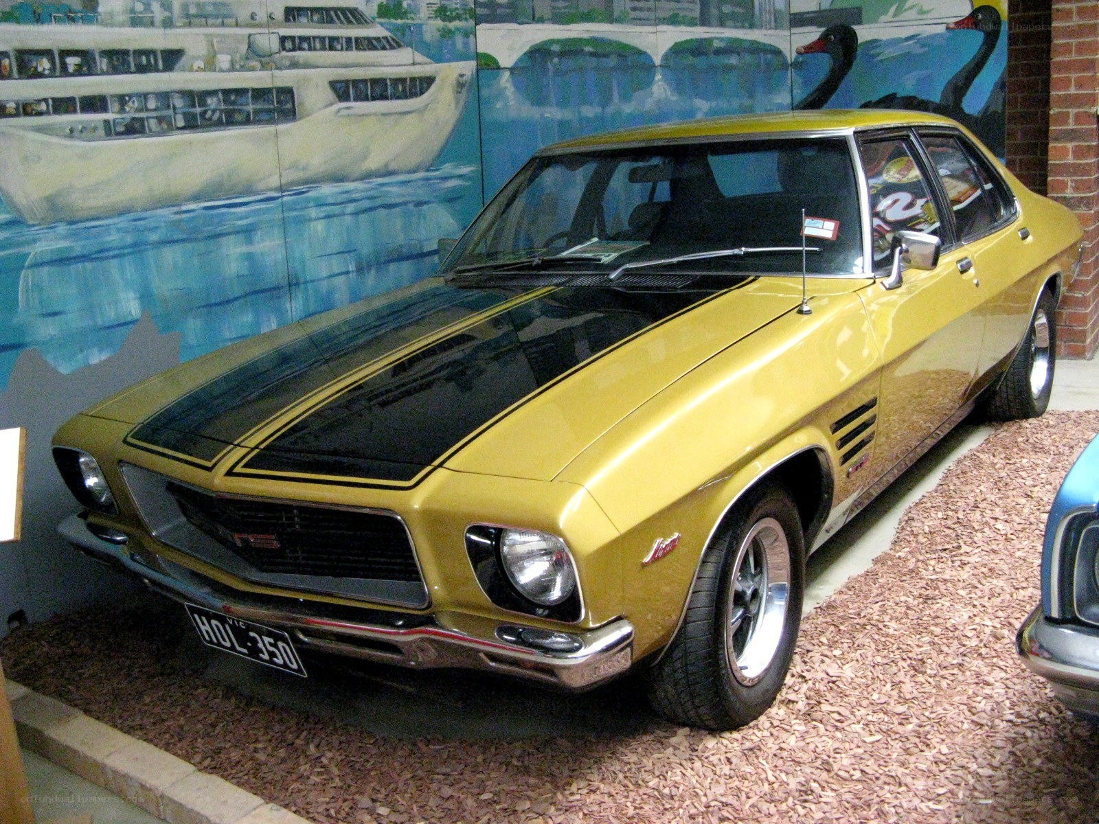 yellow classic car on display