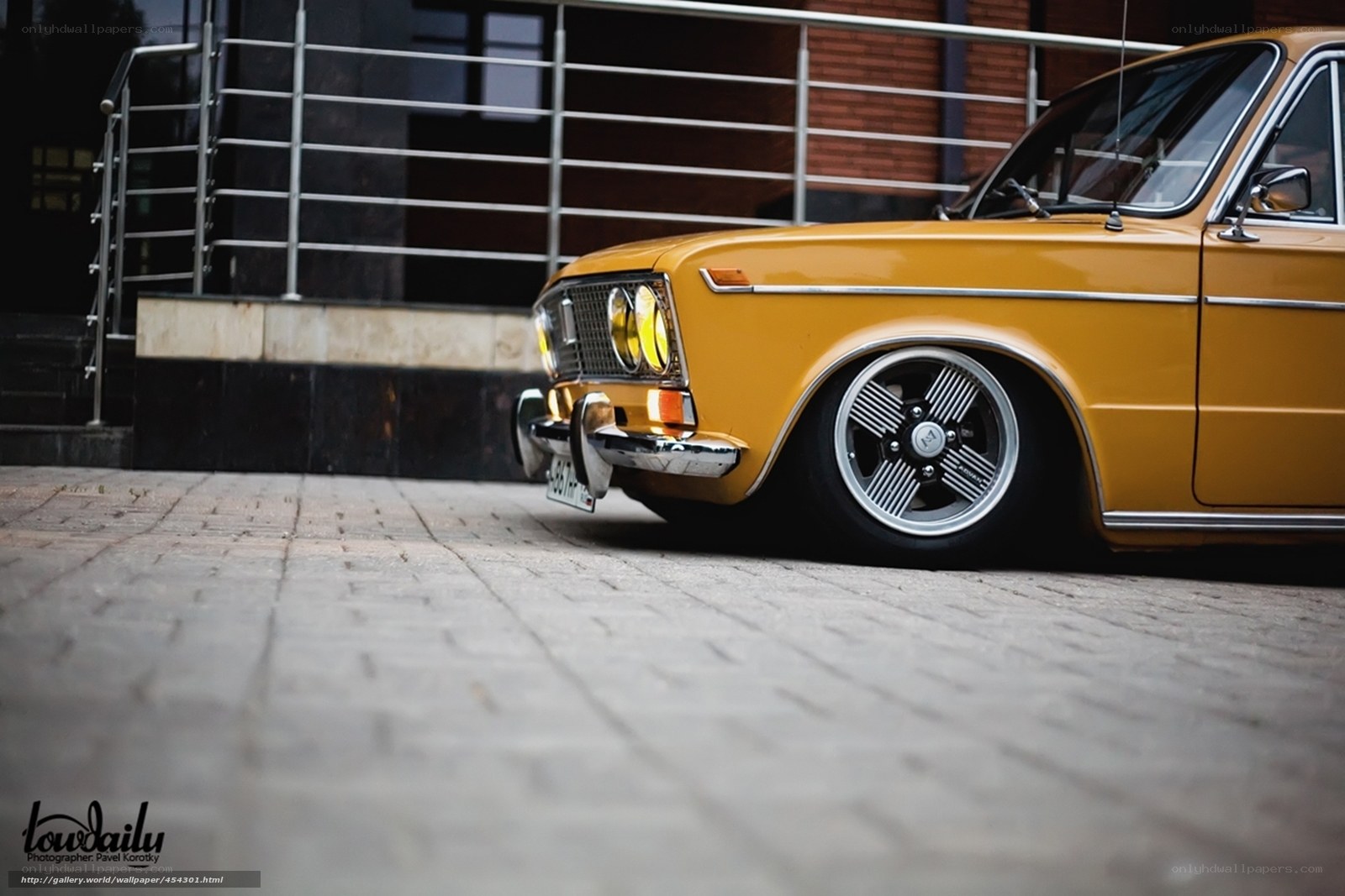 Yellow classic car on pavement