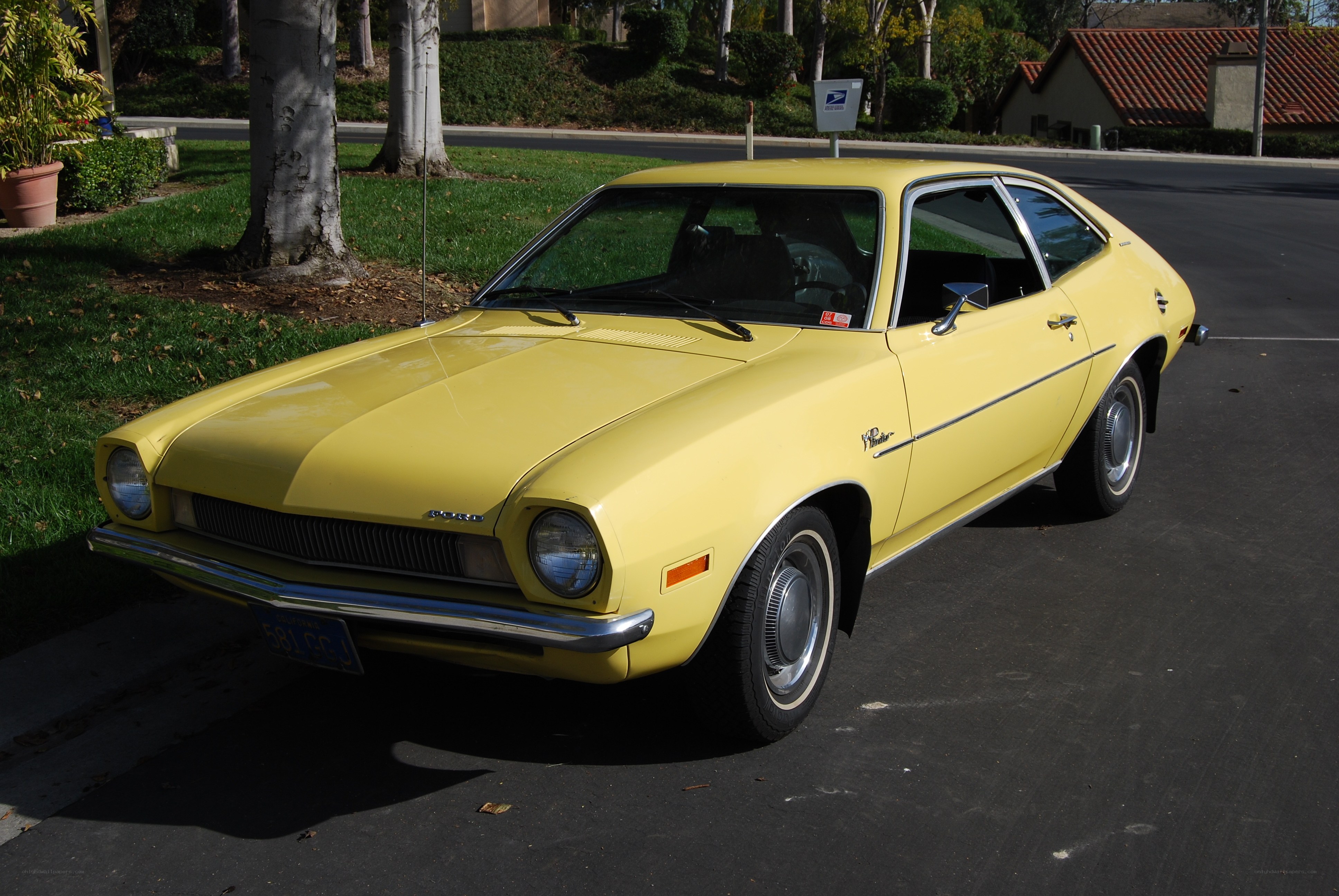 Yellow classic car parked