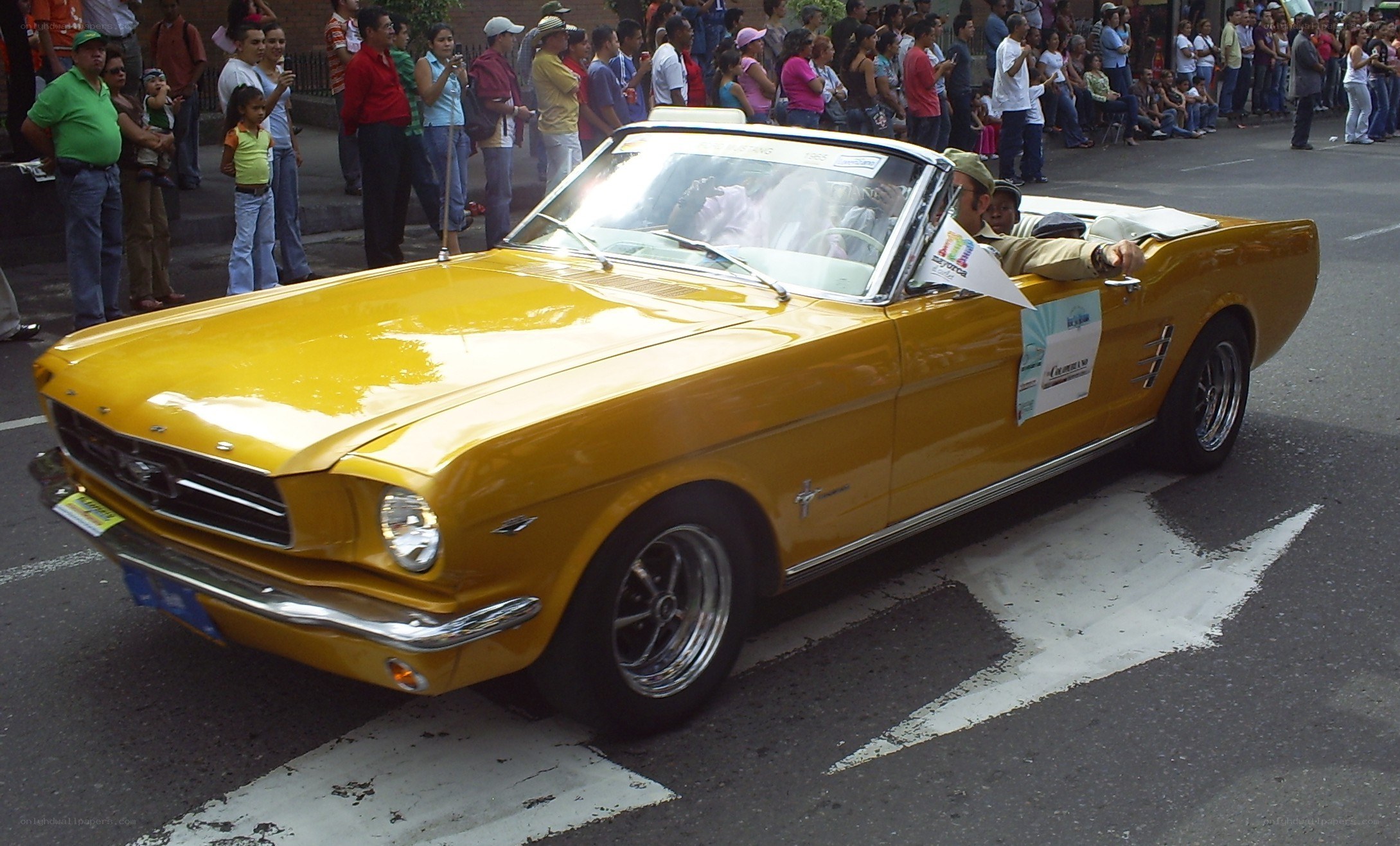 Yellow classic convertible at parade