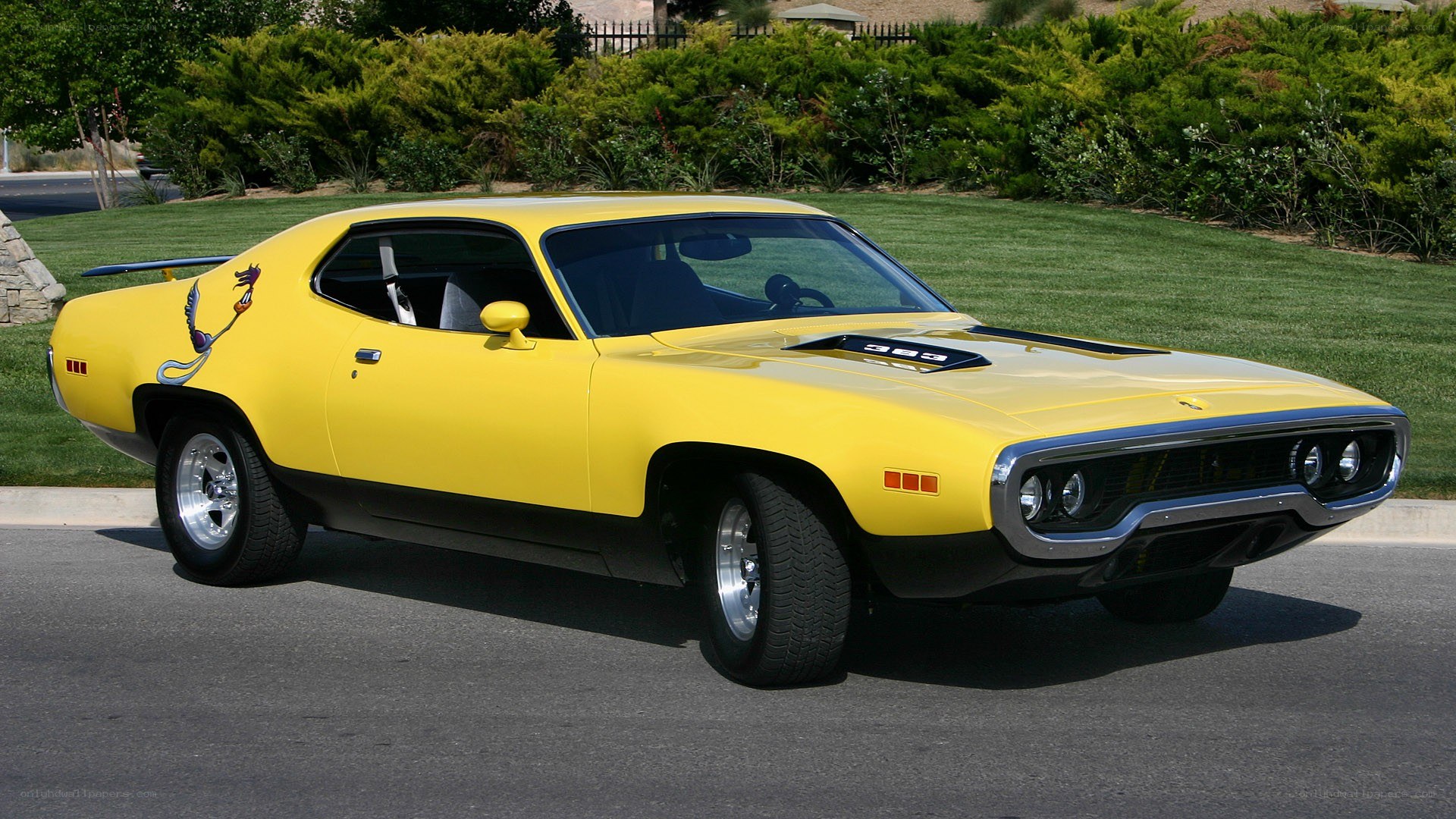 yellow classic muscle car