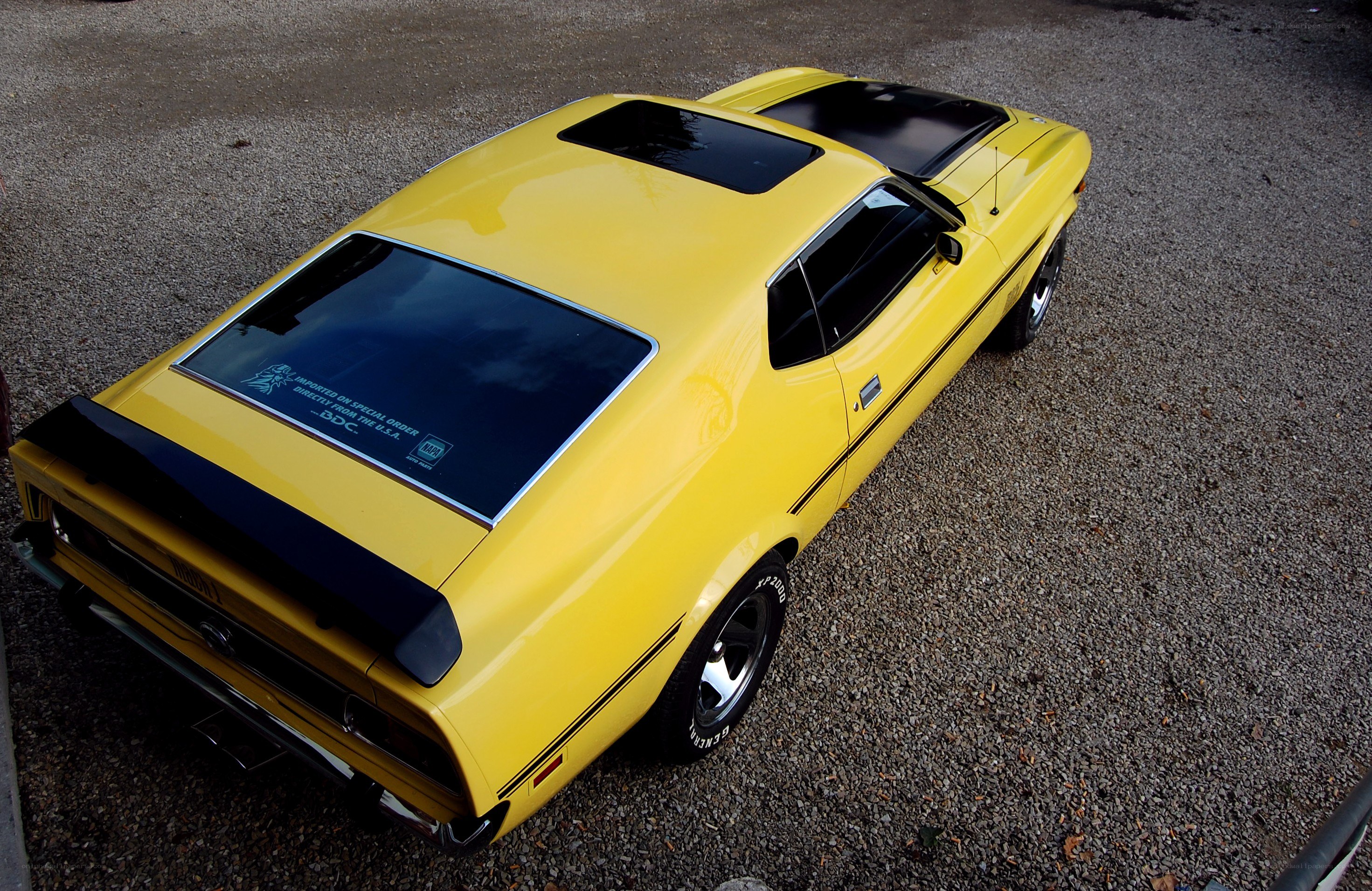 yellow classic muscle car