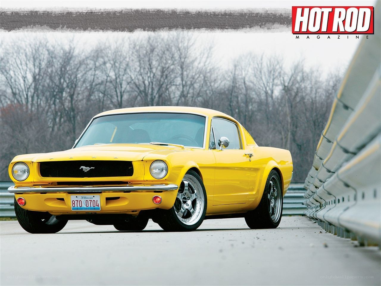 Yellow classic Mustang on track