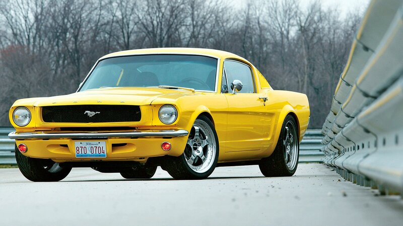 Yellow classic Mustang on track