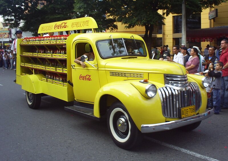 Yellow Coca-Cola delivery truck