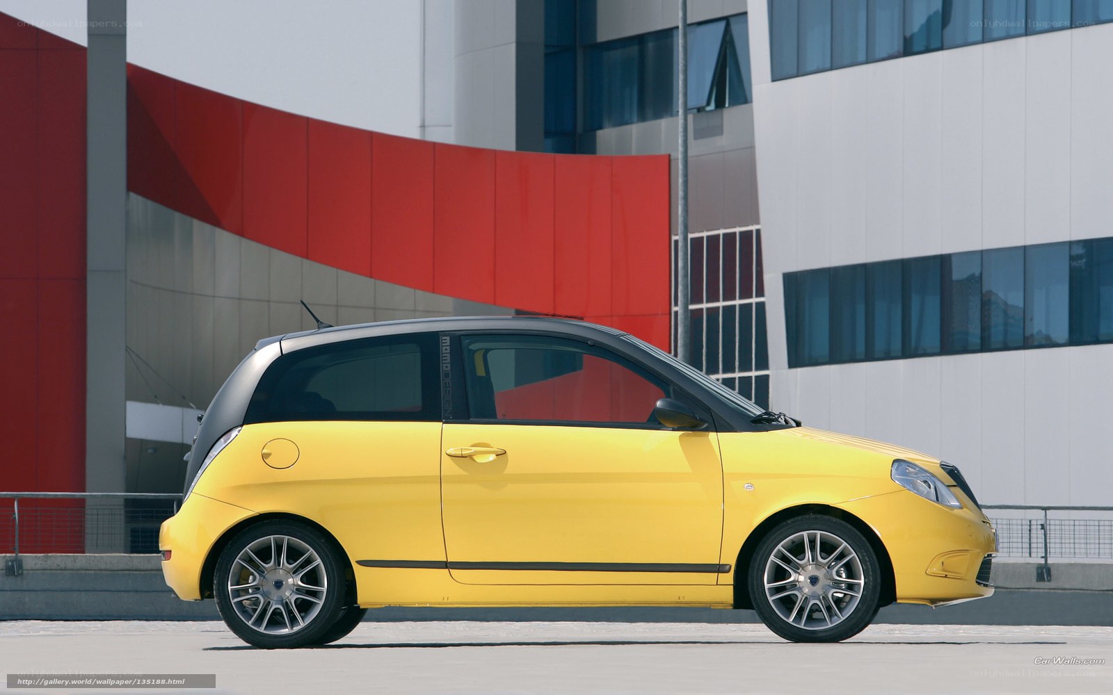 yellow compact car in city