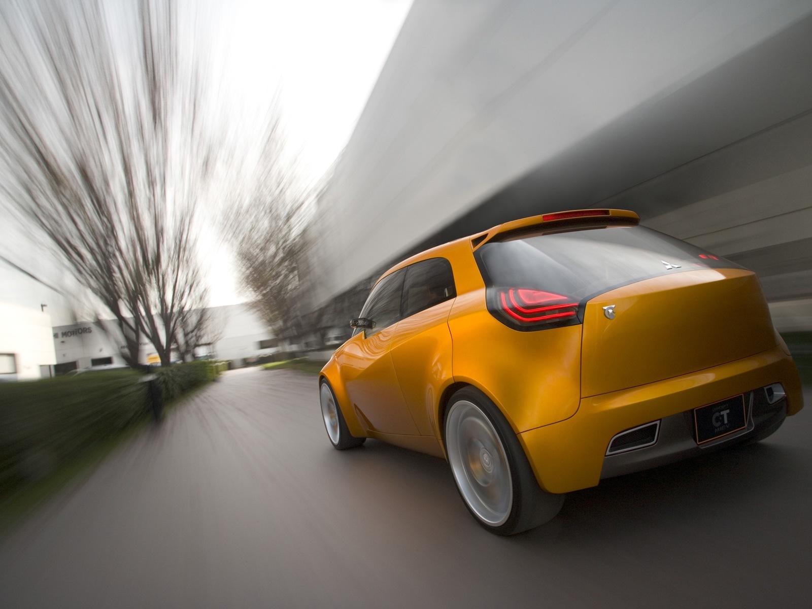 Yellow concept car in motion