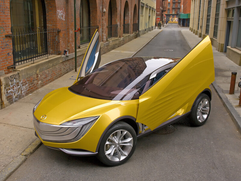 Yellow concept car on city street