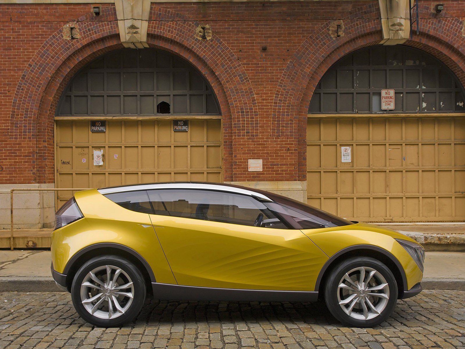 Yellow concept car on cobblestones