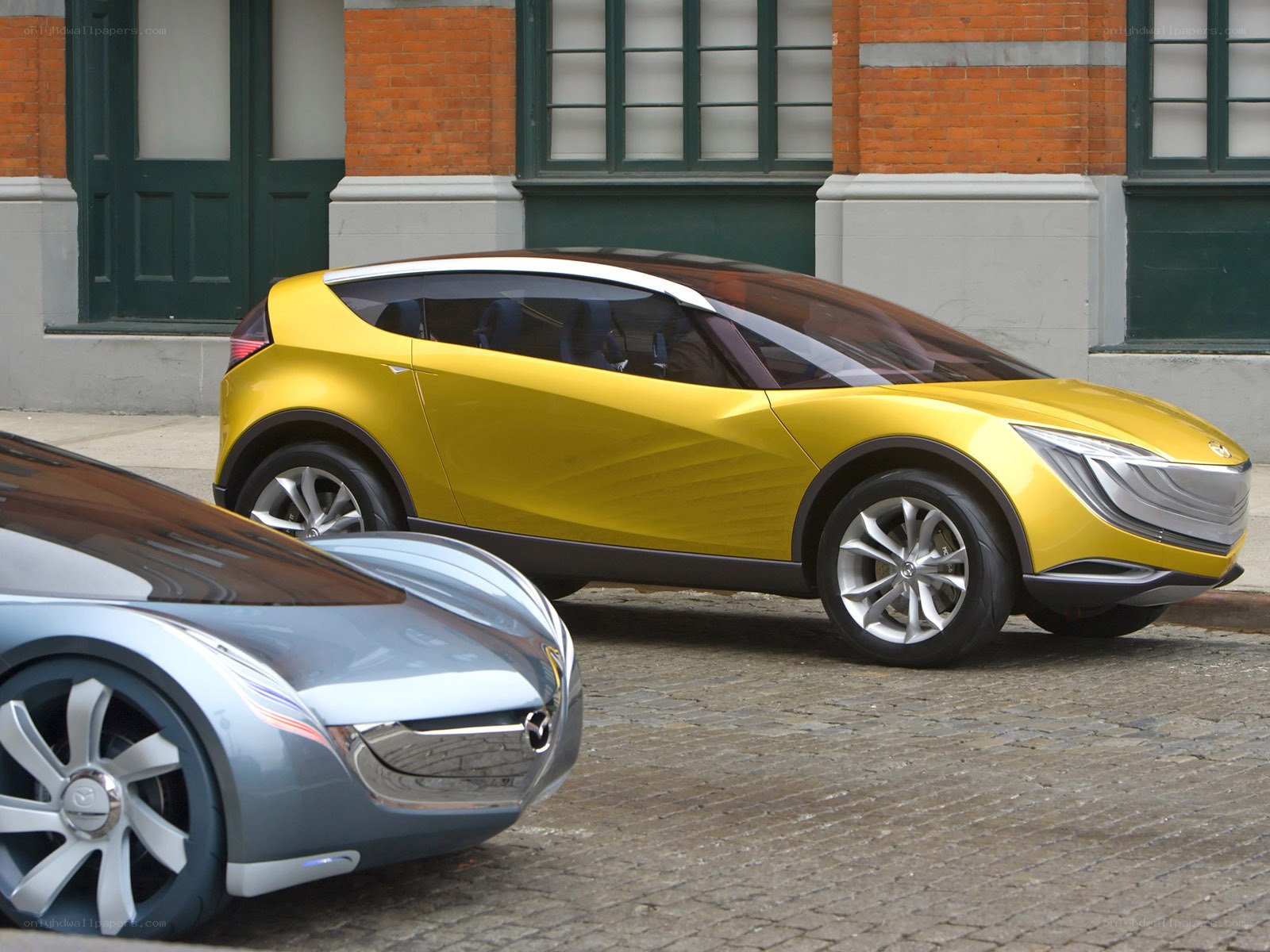 Yellow concept car on cobblestones