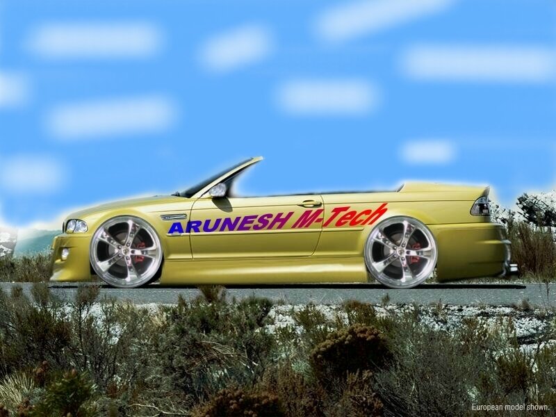 yellow convertible car on road