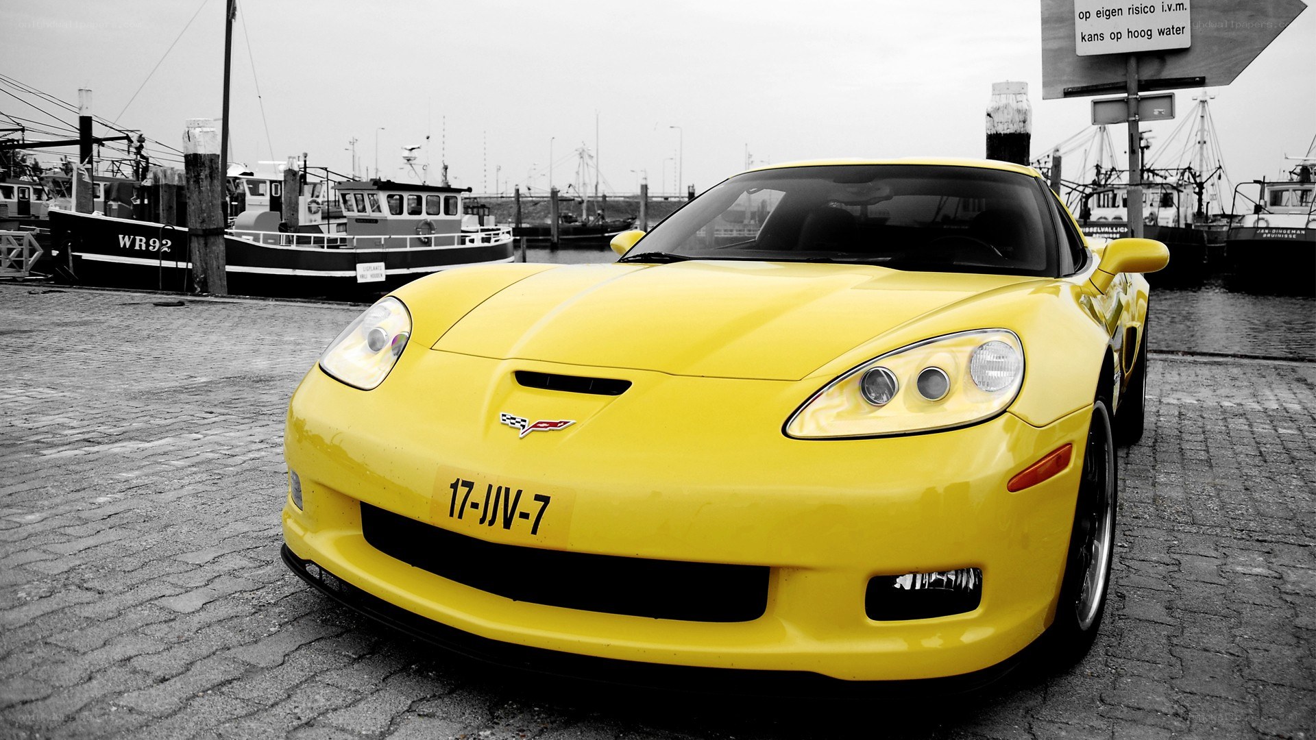 Yellow Corvette at a harbor