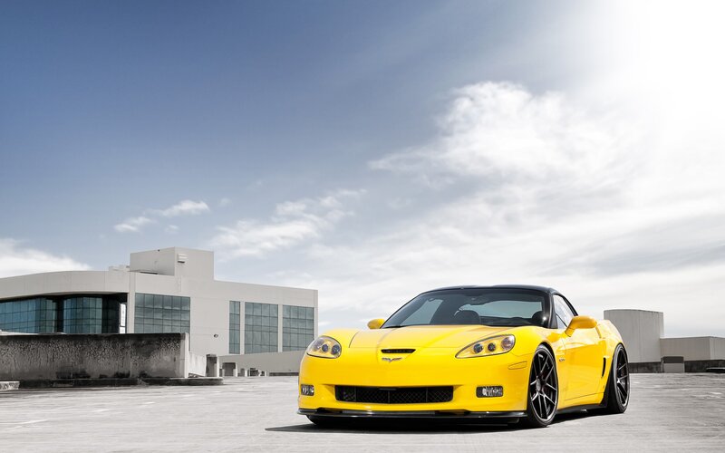 Yellow Corvette Car — Dramatic, Afternoon, Photograph, Building, Sky