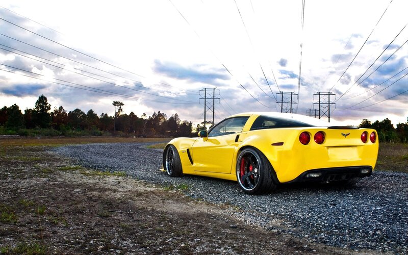 Yellow Corvette Car — Dramatic, Sunset, Photograph, Gravel Road, Power Lines