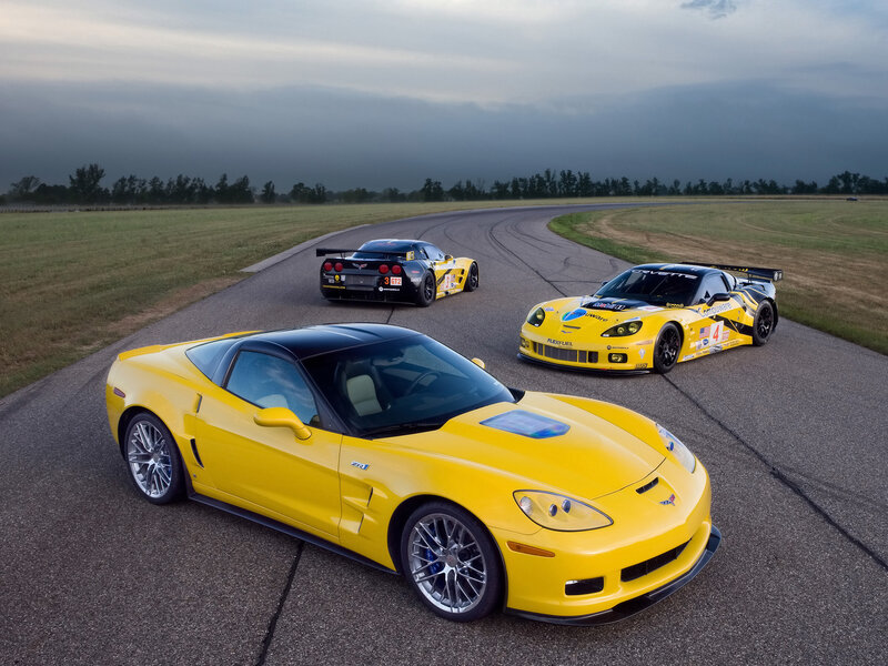 Yellow corvette cars on a racetrack