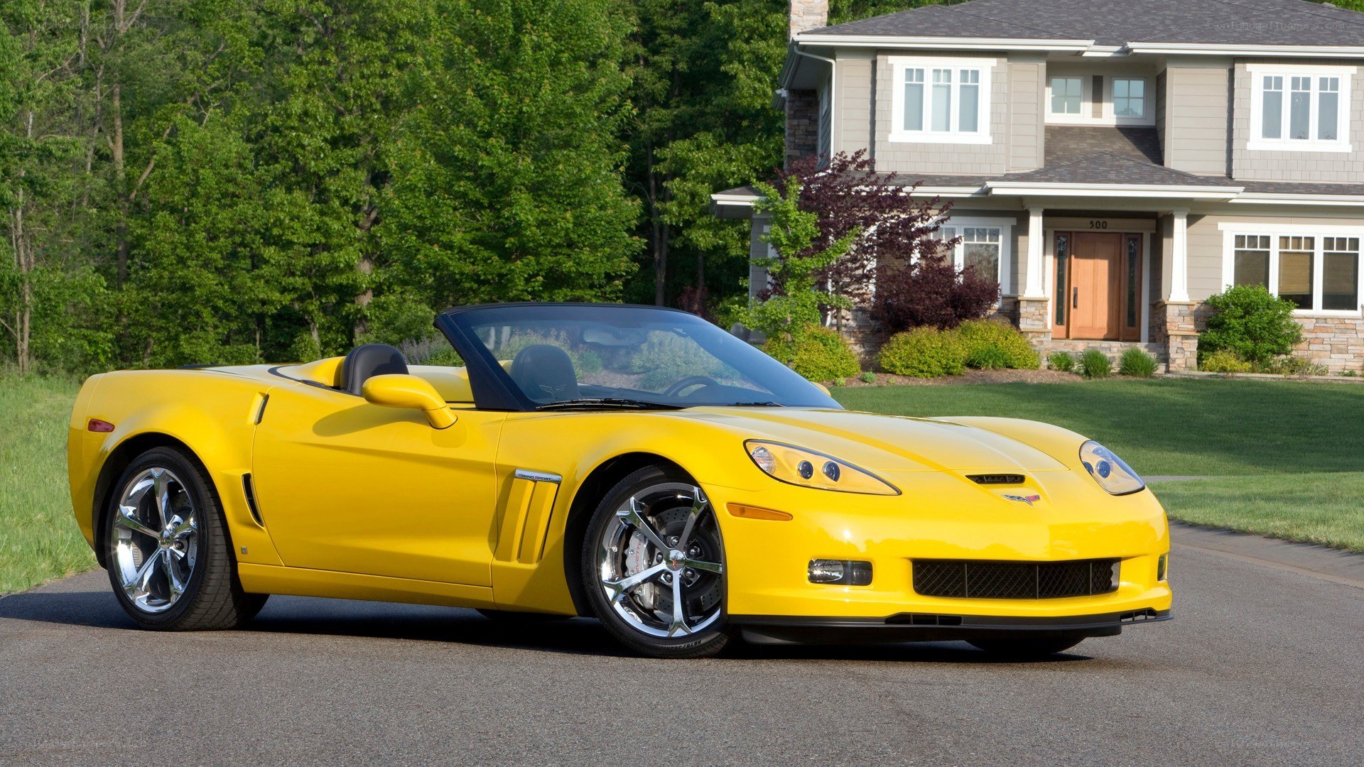 Yellow Corvette convertible parked