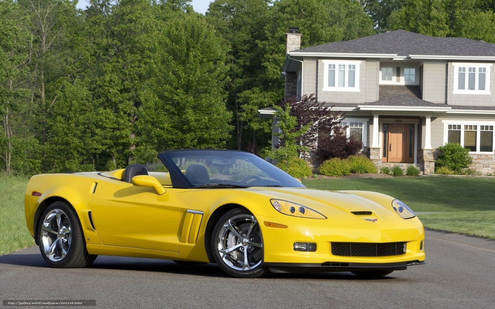 Yellow Corvette convertible parked