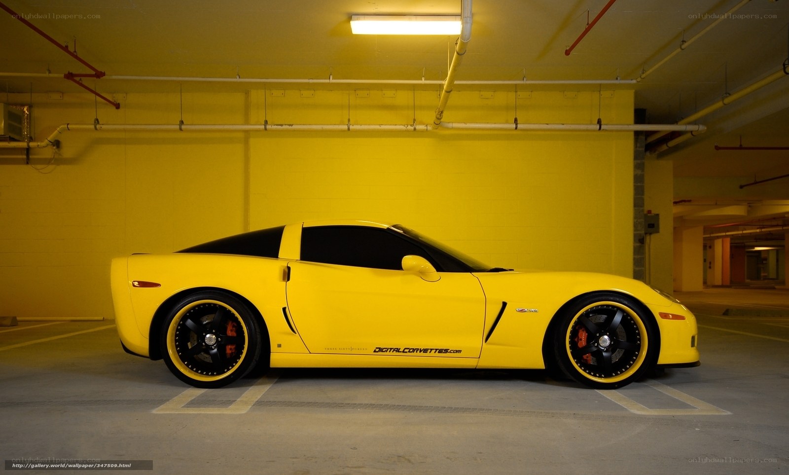 yellow corvette in garage