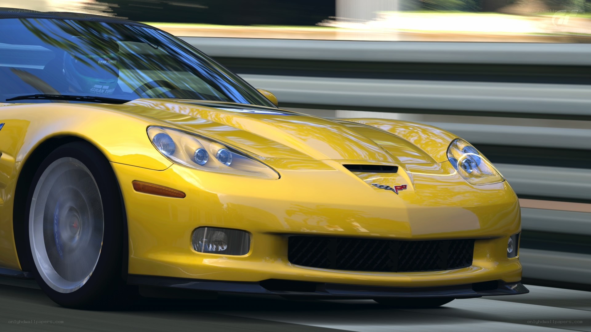 Yellow Corvette in motion