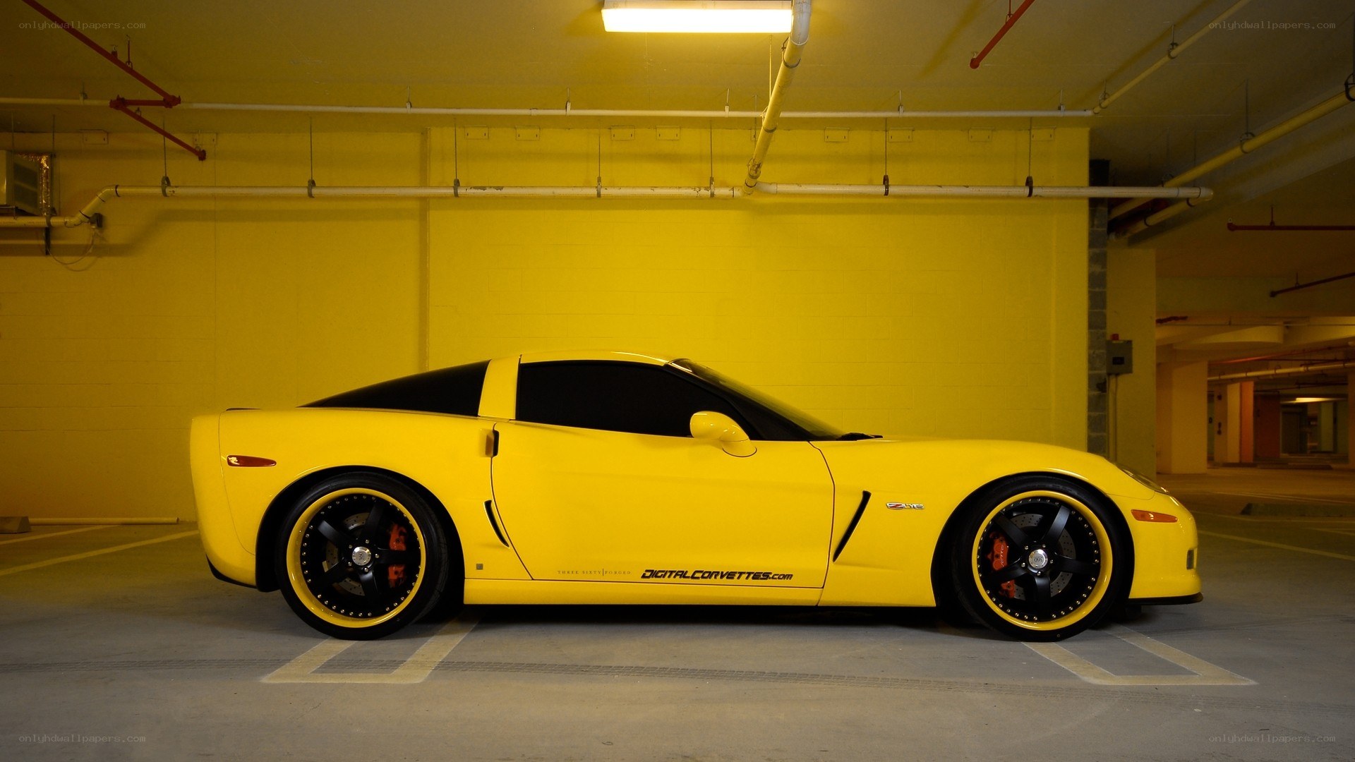 yellow corvette in parking garage
