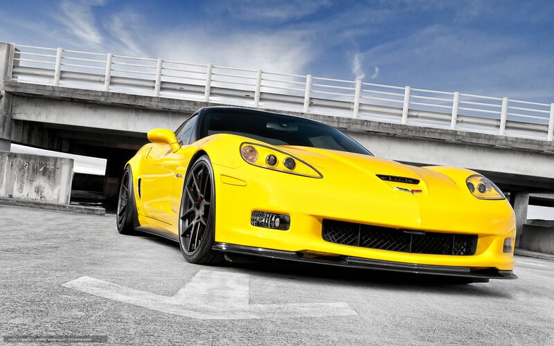 Yellow Corvette on a bridge