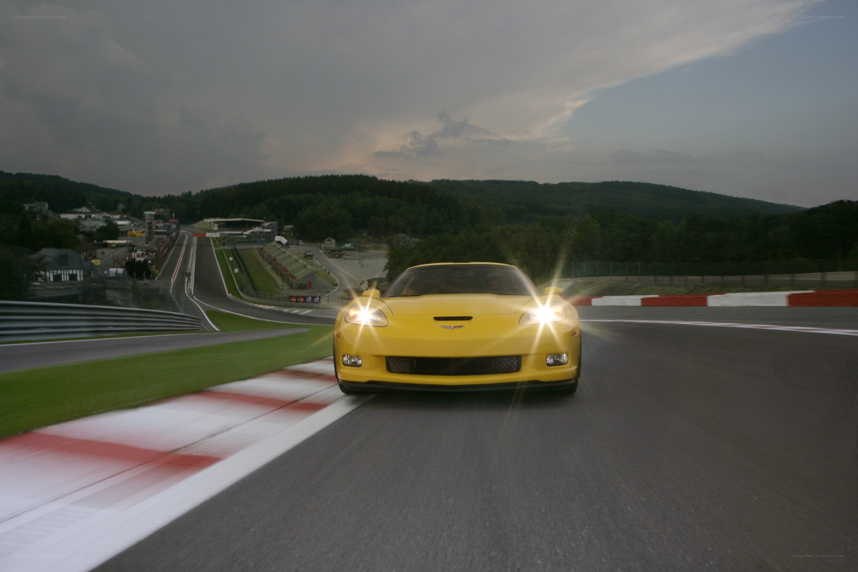 Yellow Corvette on a racetrack
