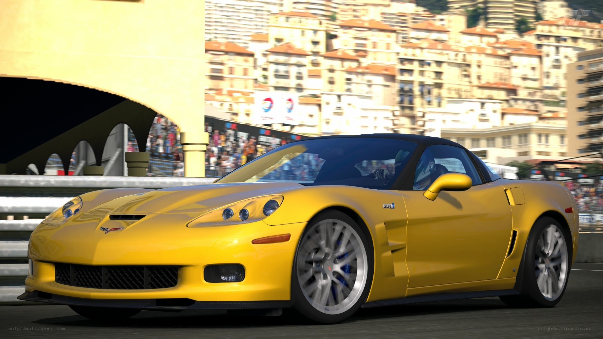 Yellow Corvette on a racetrack