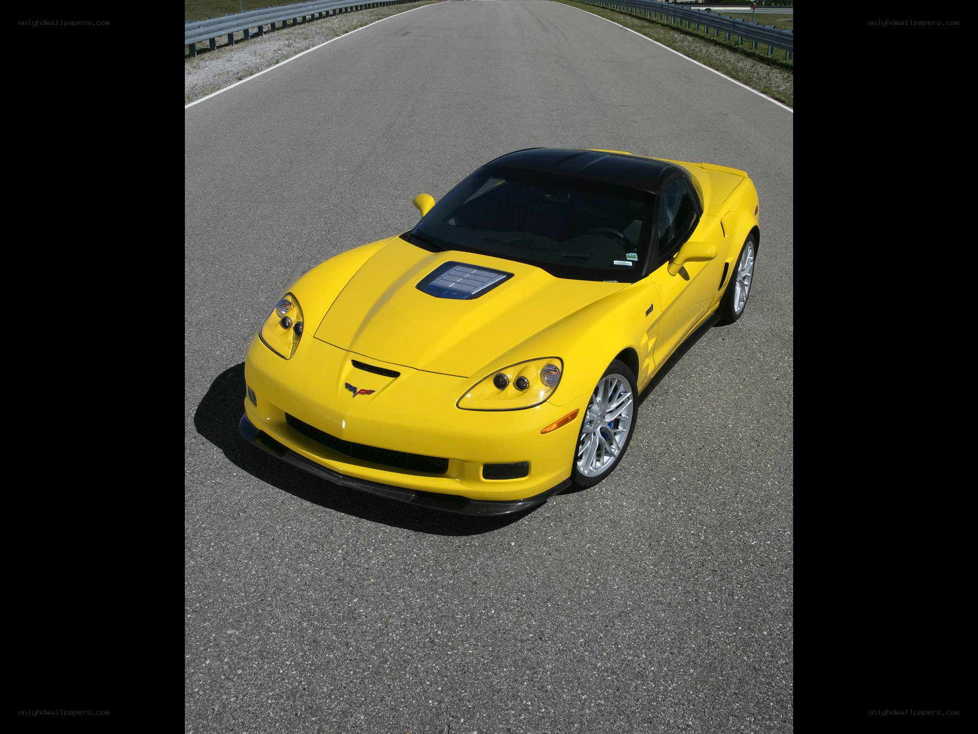 Yellow Corvette on a racetrack