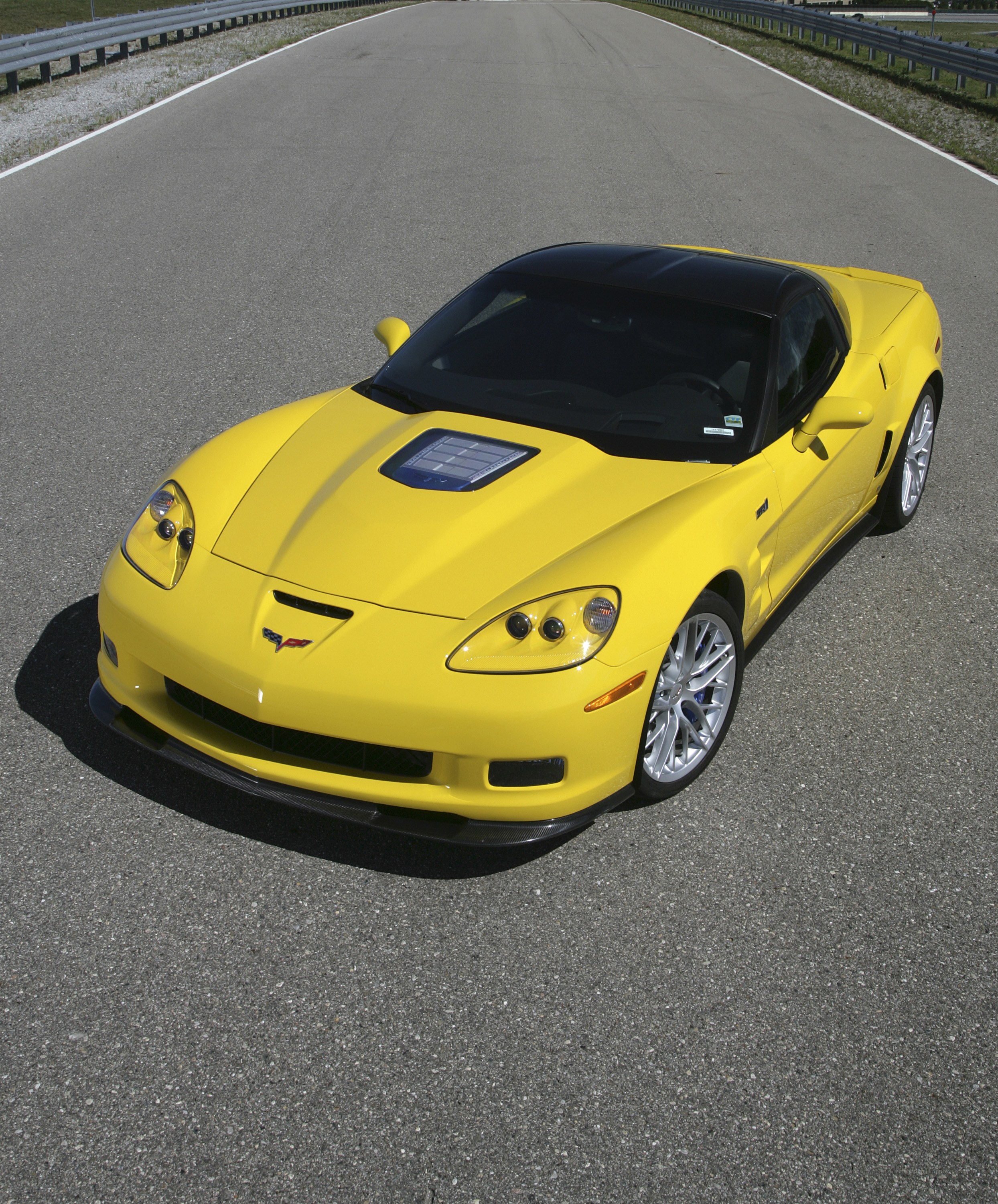 Yellow Corvette on a racetrack