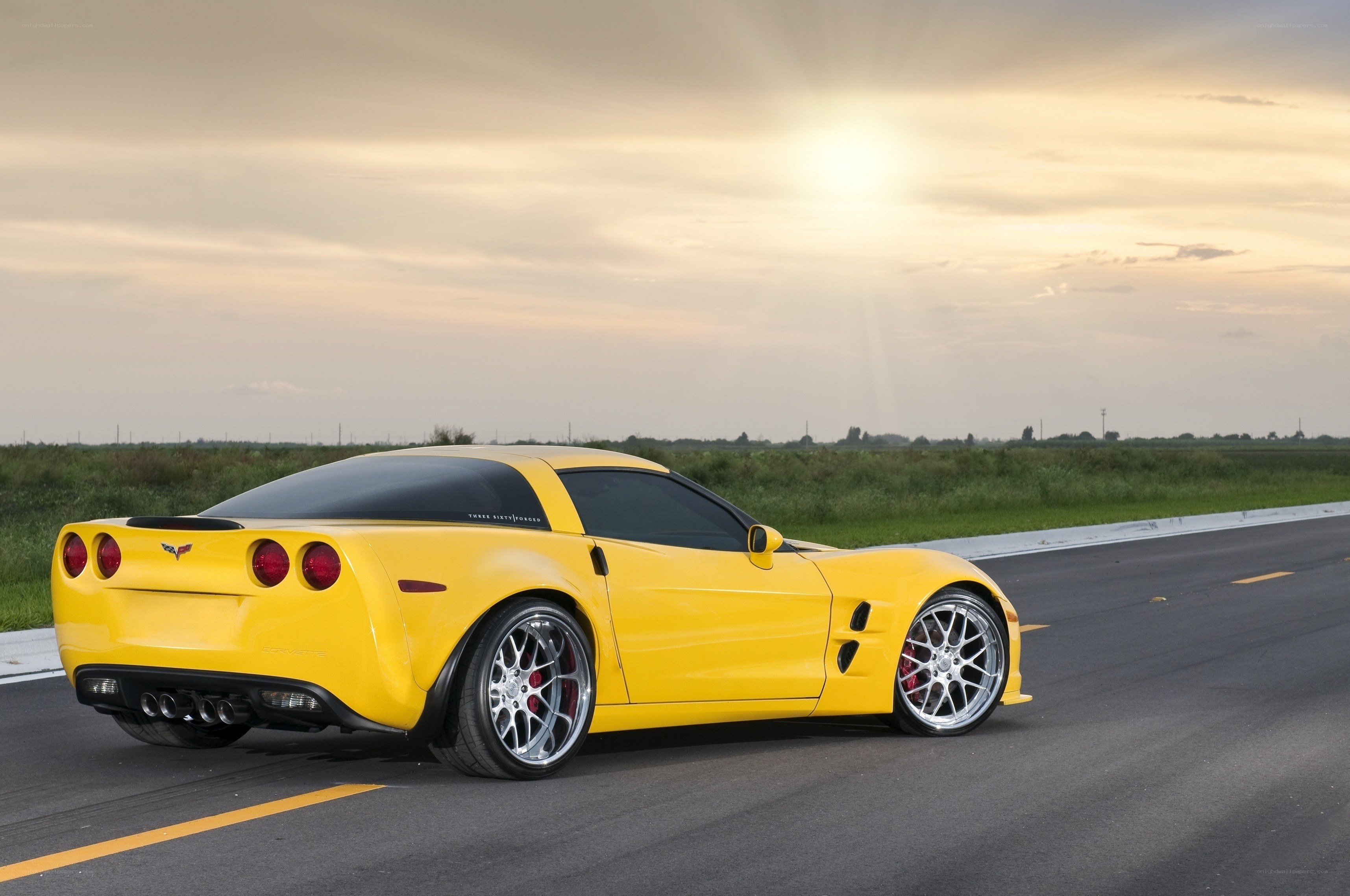 Yellow Corvette on a road