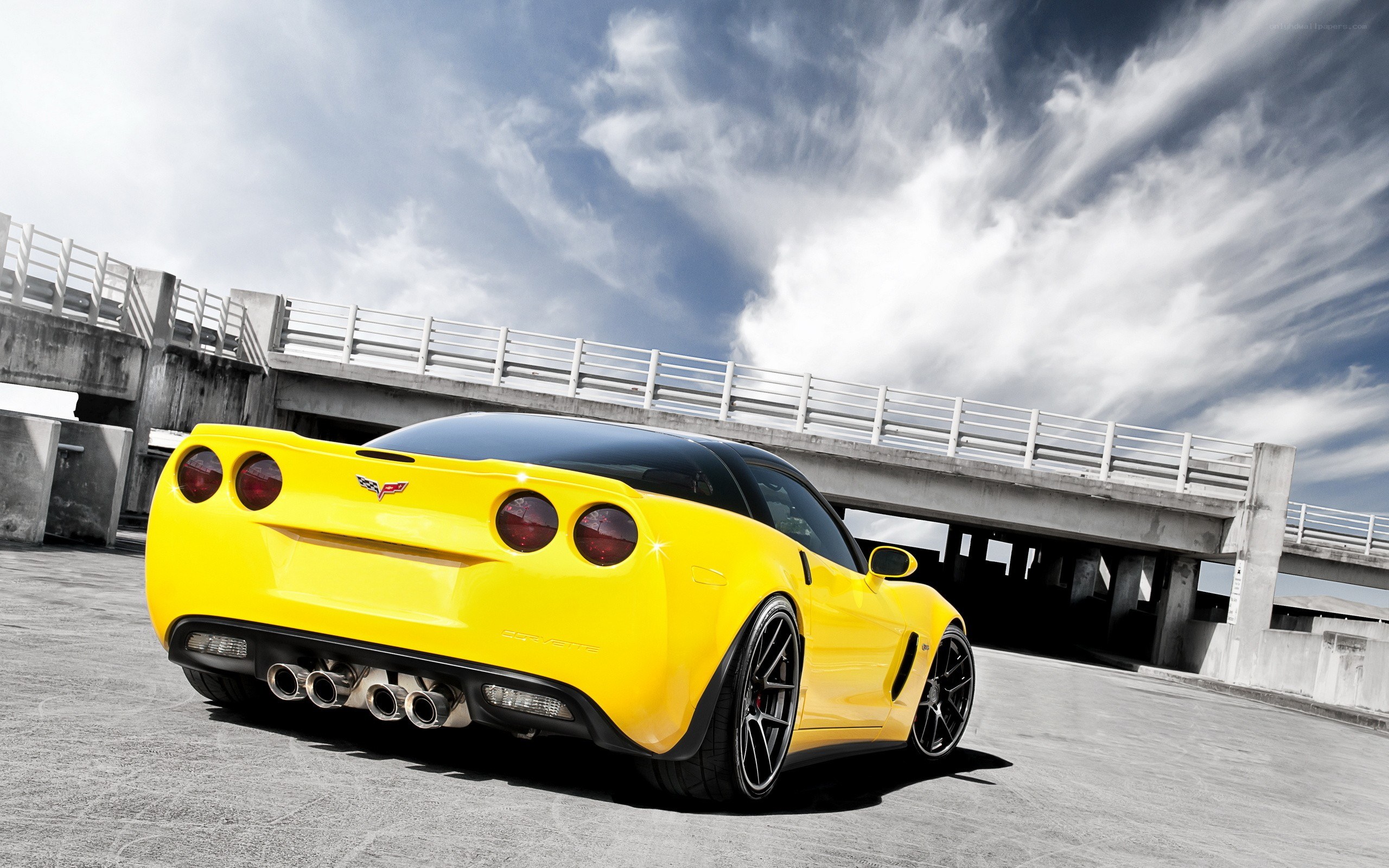 Yellow Corvette on concrete