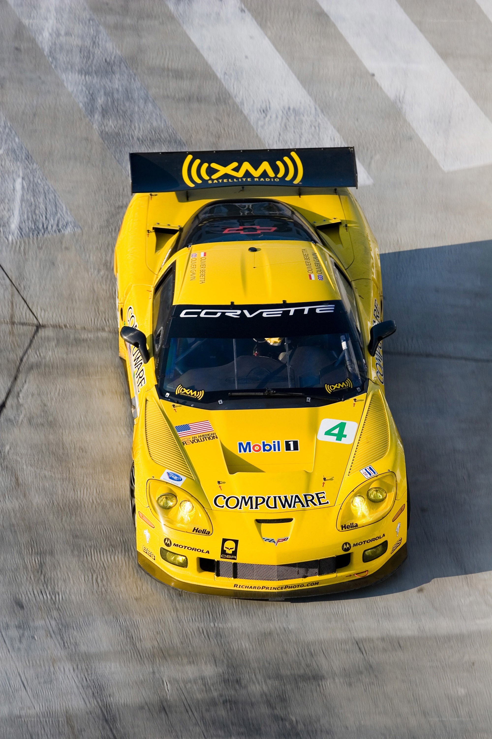 Yellow Corvette race car on track