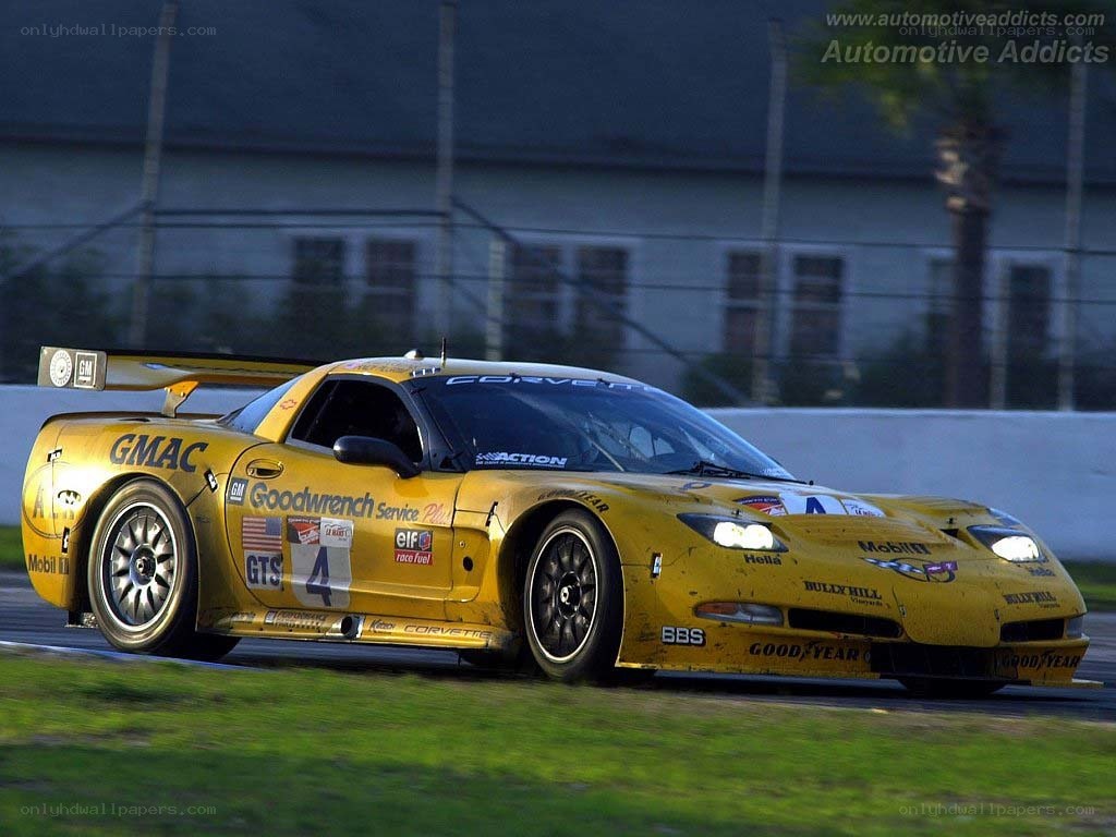 yellow corvette race car on track