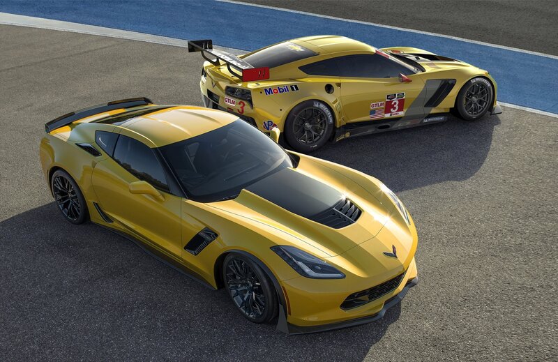 Yellow Corvette race cars on track