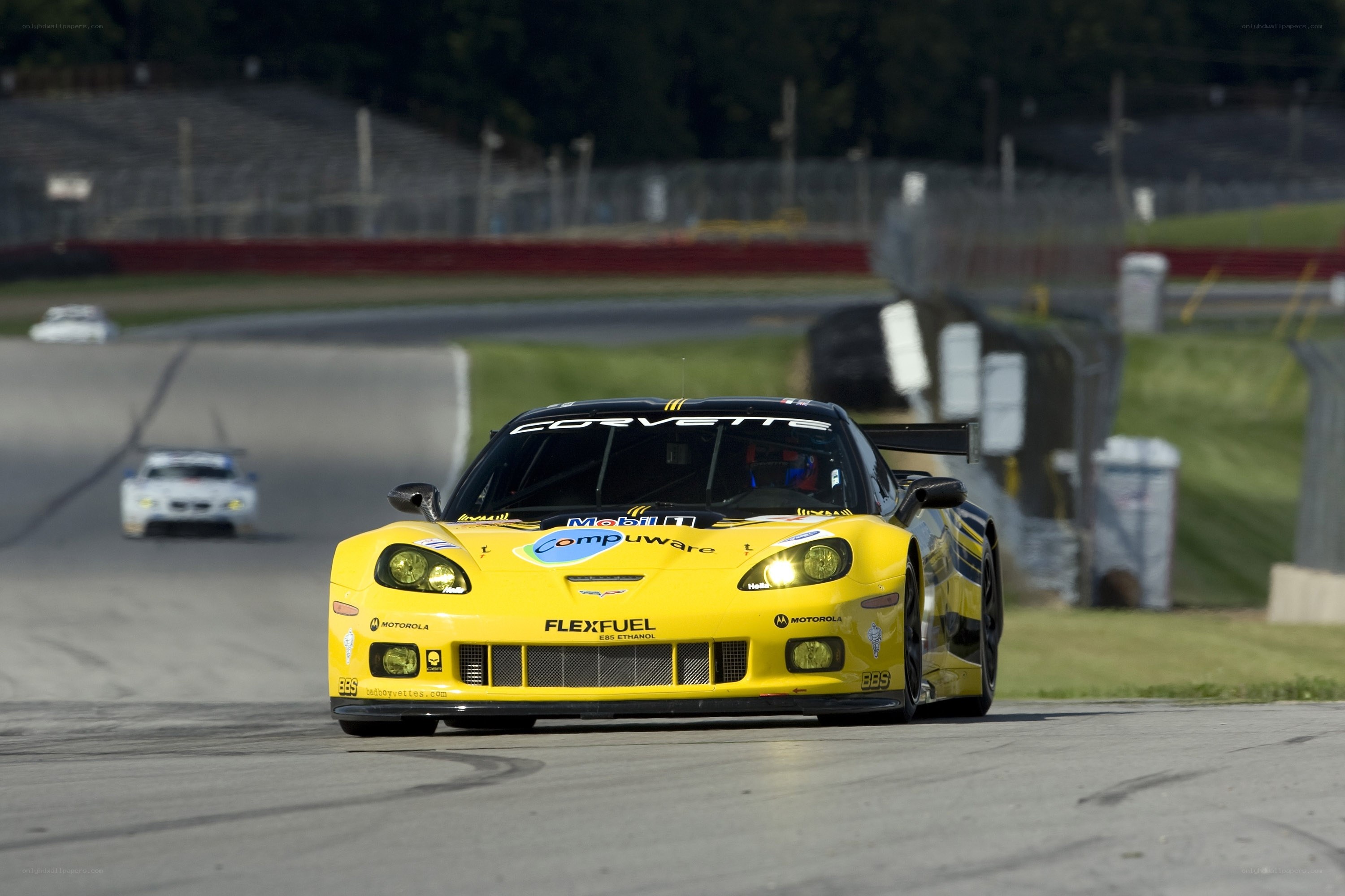 Yellow Corvette racing on track